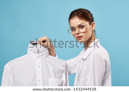 White shirt woman blue background sewing accessories mannequin                           