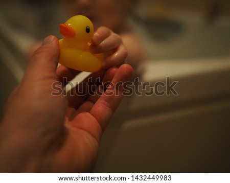 Bath Time with Ducky, Rubber Duck, Child Hand - A unique and lovely treasured moment with my beautiful daughter - bath time, where is ducky daddy? - my daughter`s favourite bathtime pal, rubber duck. Royalty-Free Stock Photo #1432449983