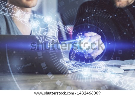 Multi exposure of data internet theme hologram with man working on computer on background. Concept of innovation.
