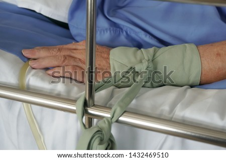 soft focus, Patient restraint on a hospital bed.  Royalty-Free Stock Photo #1432469510