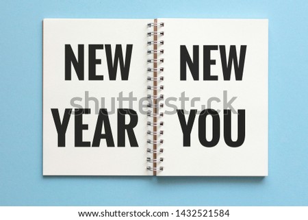 New year new you on paper notebook.
