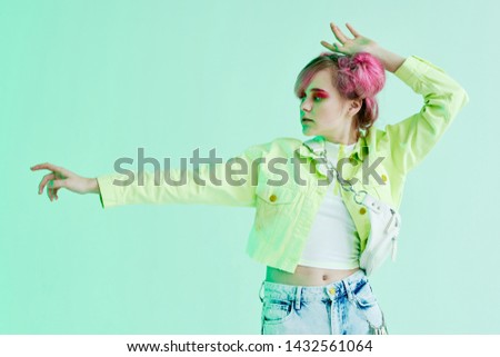 woman with pink hair on a green background