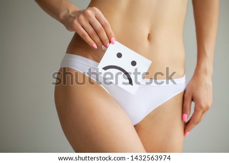 Woman Health. Female Body Holding Sad  Card Near Stomach