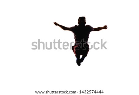 Adult caucasian male jumping while dancing. Image is isolated on a white background