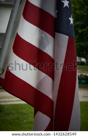 American flag hanging on porch       