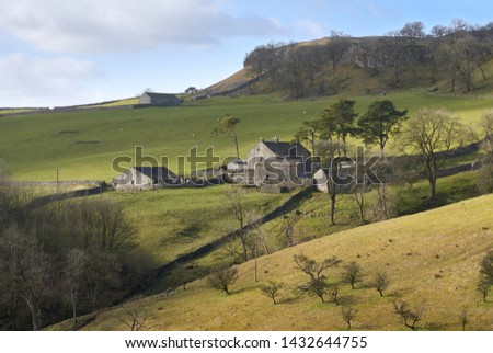 Views out over farmland and farm buildings near Horton in Ribblesdale, Yorkshire Dales. Royalty-Free Stock Photo #1432644755