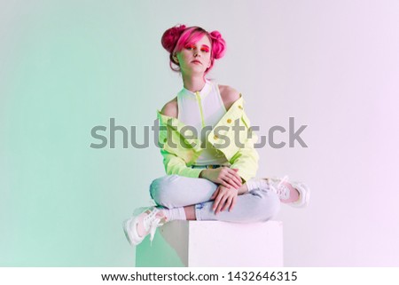 woman sitting on the stove pink hair fashion style