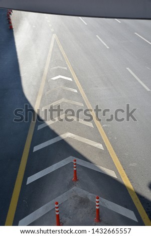 asphalt road and direction signs
