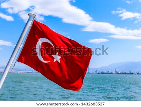 Turkish Flag is on the water at a beautiful sunny day.  