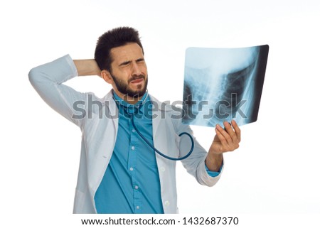   doctor with eyes closed in hand x-ray stethoscope                             
