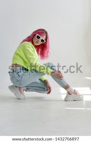 woman with pink hair in fashion style glasses
