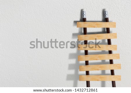 Stairs with pencil for effort and challenge in business to be achievement and successful concept.
 Royalty-Free Stock Photo #1432712861