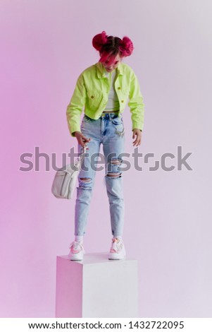 pink hair woman with bag full-length ripped jeans