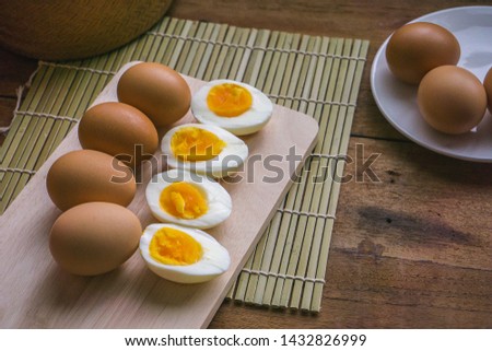 eggs picture on brown wooden and bamboo basket background.