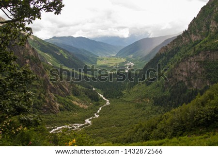 Beautiful landscape winding mountain river and view on the colorful valley