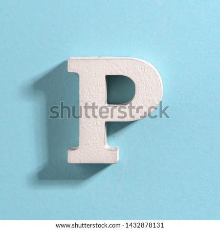 white volumetric letters with a shadow on a blue background, the alphabet