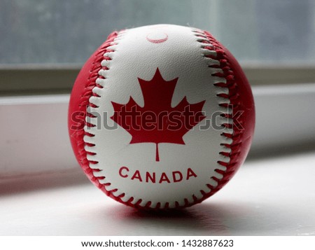 single red and white baseball