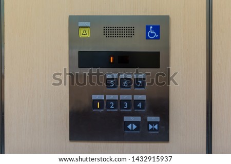 Image of disabled lift button. Stainless steel elevator panel push buttons for blind and disability people. Push Button For the disabled. Care and technology. Elevator buttons for disabled people.