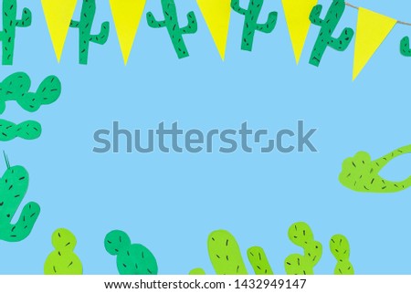 paper cactuses on blue background