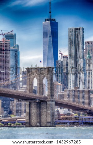 A wiew of Brooklin bridge in New york with skycraper in the background