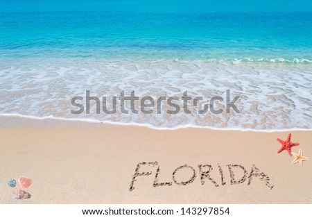turquoise water and golden sand with shells and sea stars and "florida" written on it