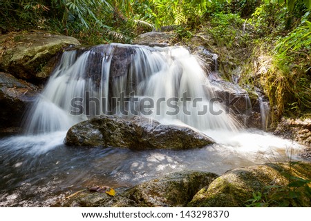 Waterfall in the park forest in the Thailand.