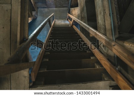 Stairwell in the church with wooden stairs