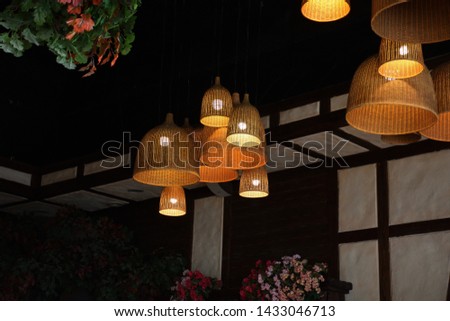 wicker lamps on the ceiling, handmade chandelier, decorative lamps Royalty-Free Stock Photo #1433046713