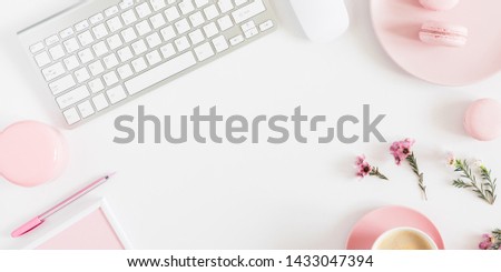 Fashion beauty blogger working space with laptop keyboard, female fashion accessories, flowers, coffee, macaroon and decorations on white background. Flat lay, top view, copy space