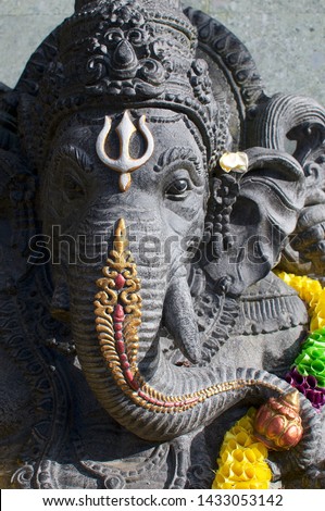 Picture of a beautiful black Ganesha stone statue located in Ubud, Bali - Indonesia