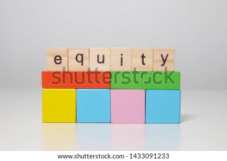 Wooden block with the word tiles equity for education purpose. Royalty-Free Stock Photo #1433091233