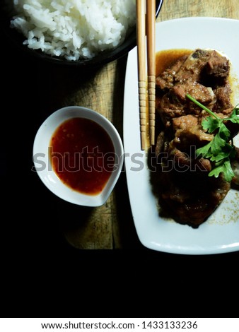 Top view picture of roasted pork ribs and rice. selective focus