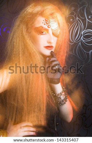 Young woman in artistic image with one-eyed visage