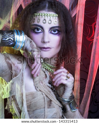 Mummy. Young woman in creative theatrical image and with artistic visage.
