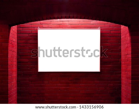 Empty space for advertising on red brick wall with spotlight
