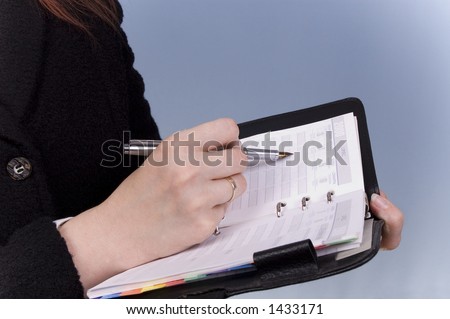 Businesswomen signing the paper