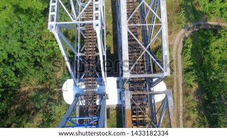 the infrastructure of the double railroad tracks and bridges can be seen from above through the aeria drone camera