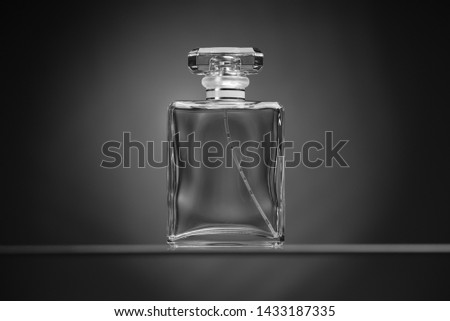 Perfume glass bottle, black and white background