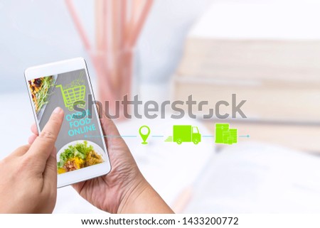 Food delivery service or order food online at home and icon media symbol on touch screen smart phone. Business and technology for shopping online with lifestyle in city concept.