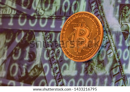 cyripto money mining. close up physical bitcoin coin with dollars and matrix codes background