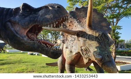 Images of statues and large dinosaurs