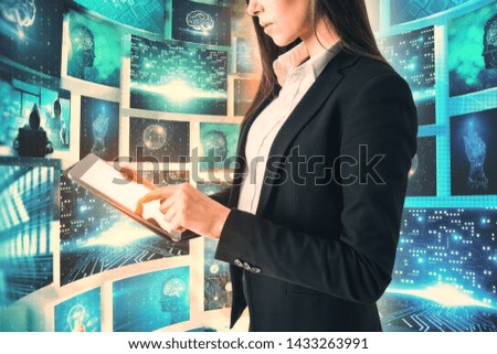 Businesswoman using tablet with abstract digital business picture interface. Innovation and media concept. Double exposure