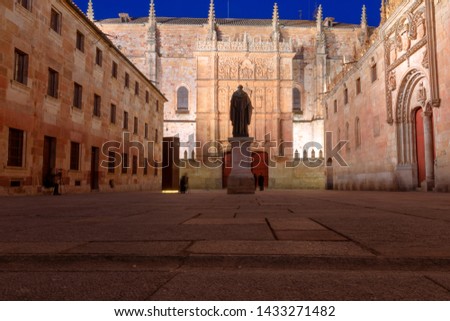 Courtyard of major schools, with the statue of Fray Luis de Leon and the façade of the old University of Salamanca, at night