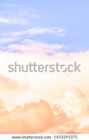 Vertical size of the twilight sky with effect of light pastel tone. Colorful sunset of soft clouds. Background