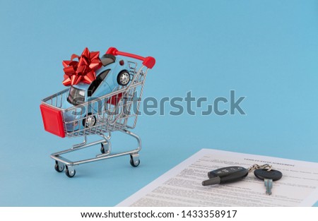 Concept of selling cars on blue background. Sell and buy car, car financing, car key for Vehicle Sales.  Buying car. Copy space