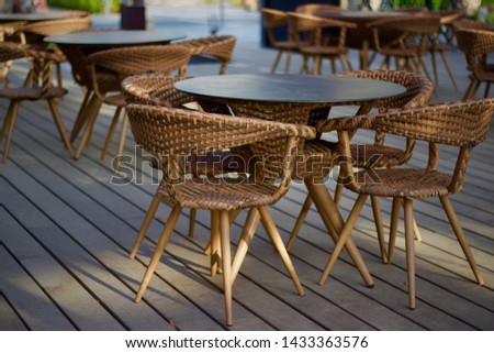 Bamboo cane rattan chairs and table to serve as exterior seating arrangement