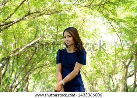 Asian women Smiling happily, natural blurred background