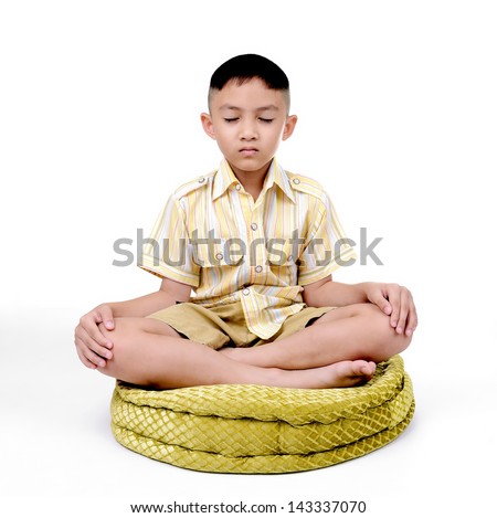 Boy in a lotus pose meditation and yoga