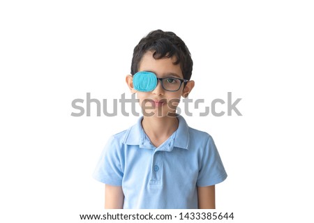 Portrait of boy in glasses with patch. Eye patch for glasses t treat lazy eye, amblyopia, strabismus. Royalty-Free Stock Photo #1433385644