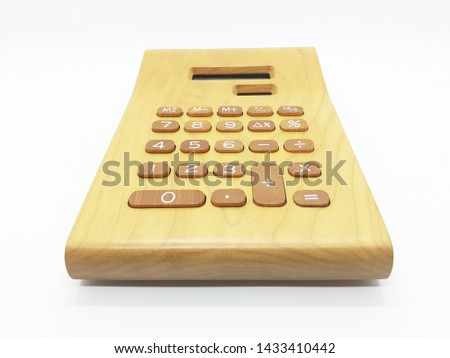 Artistic Wooden Calculator for Office Equipment and Interior Decorative Conceptual Design in White Isolated Background